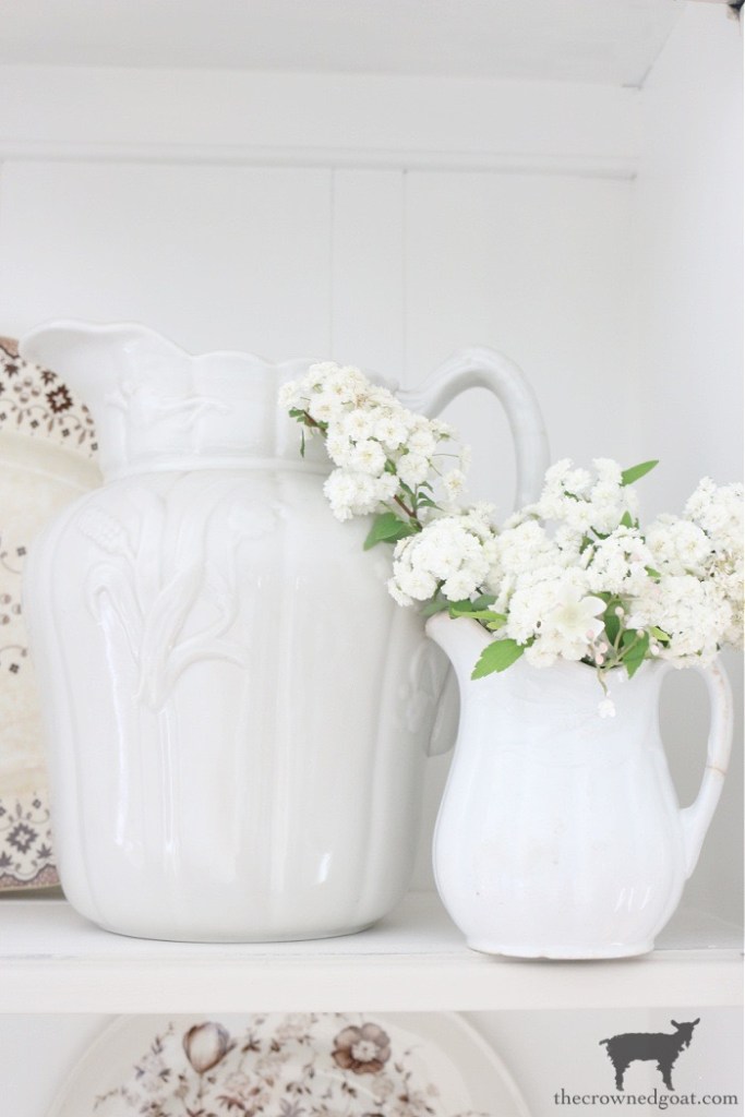 How to Style a Small Hutch - Large and Small Ironstone Pitchers with Flowers - The Crowned Goat